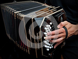 Playing traditional bandoneon.