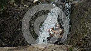 Playing trumpe in a waterfall