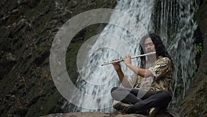 Playing trumpe in a waterfall