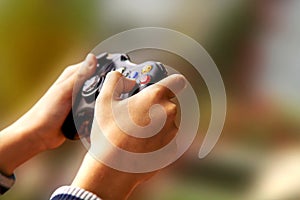 Playing video games on Xbox console photo