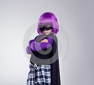 Playing villain. A studio shot of a confident little girl playing dress-up.