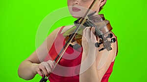 Playing the violin close up. Green screen