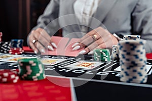 Playing woman poker and gambling in casino, spending time in games of chance
