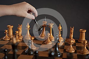 Playing wooden chess pieces. Losing a game of chess