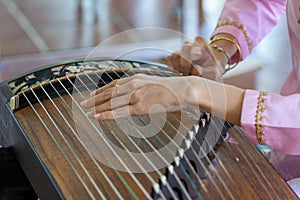 Playing the zither's moment