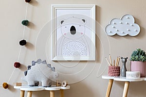 Playroom for kids with cute toys and mockup poster frame in Scandinavian style.