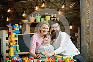 Playschool concept. Playschool kid play with mother and father. Happy family in playschool. Playschool education and