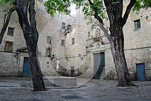Plaza de Sant Felip Neri, square with the fountain in gothic quarter, Barcelona photo