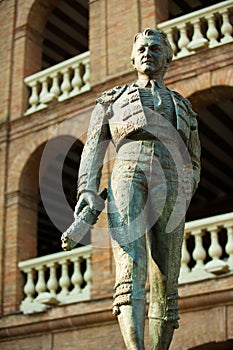 Plaza de toros de Valencia bullring with toreador statue photo
