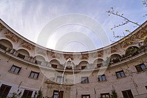 The Plaza del Cabildo is located in the Arenal neighborhood of Seville, Spain