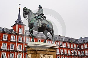 Plaza Mayor with statue of King Philip III in foreground, Madrid, Spain