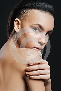 Pleasant charming woman resting her chin on the shoulder