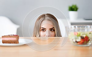 Pleasant crafty woman choosing what to eat