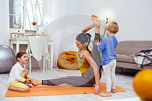 Pleasant flexible woman doing a physical exercise