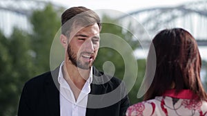 Pleasant handsome guy meeting neighbour outdoor