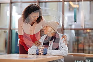 Pleasant homeless woman wanting to drink water