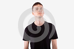 Young caucasian man haughtily looking at camera. Isolated on white background photo