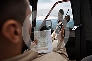 Pleasant male expeditor holding his radio set