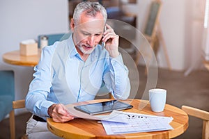 Pleasant man talking on cell phone