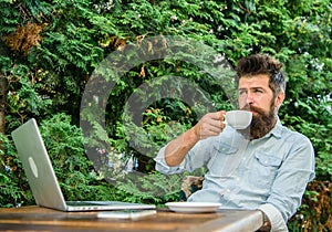 Pleasant moment. Take moment to enjoy life. Man bearded hipster make pause for drink coffee and relax while sit with