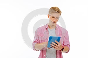 Pleasant nice man typing a message online