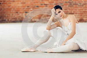 Pleasant relaxed ballerina posing to the camera