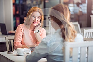 Pleasant senior woman conducting an interview