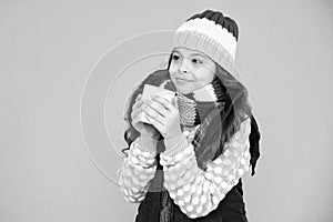 Pleasant sip. Kid winter fashion. Child warm knitwear. Have warming drink. Drinking hot cocoa. Hot chocolate recipe