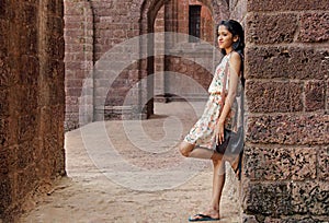 Pleasant Teenage Girl in Brick Courtyard