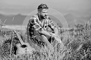 Pleasant time alone. Musician looking for inspiration. Dreamy wanderer. Wanderlust concept. Summer vacation highlands