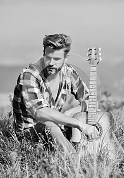 Pleasant time alone. Peaceful mood. Guy with guitar contemplate nature. Inspiring nature. Musician looking for