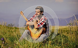 Pleasant time alone. Peaceful mood. Guy with guitar contemplate nature. Wanderlust concept. Inspiring nature. Summer