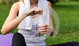 Pleasant woman drinking water