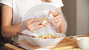 Pleasant young woman preparing dinner in a kitchen concept cooking.