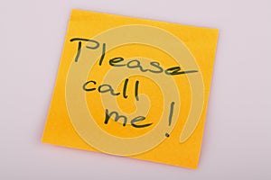 Please call me note on orange sticker note on white