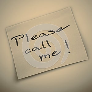 Please call me note on orange sticker note on white