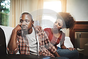 Please could we talk this through together. a young couple having relationship problems at home.