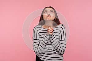 Please god, I`m begging! Portrait of unhappy woman looking up with beseeching imploring expression, praying