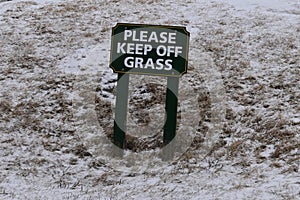 Please Keep Off Grass sign on snowy day, Cape Elizabth, Cumberland County, Maine, United States, New England US