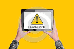Please Wait Message on Digital Tablet Computer Display