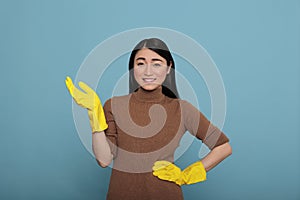 Pleased cheerful and positive asian houseworker from chores