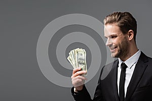 pleased executive manager holding dollars isolated