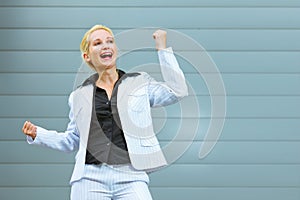 Pleased modern business woman at office building