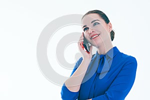 Pleased real estate female agent talking on mobile phone. Isolated on white.