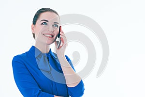 Pleased real estate female agent talking on mobile phone. Isolated on white.