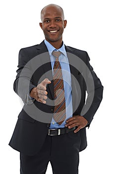 Pleased to meet you. An ethnic male in a business suit with his hand out for a handshake.