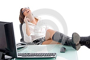 Pleased woman sitting in office photo
