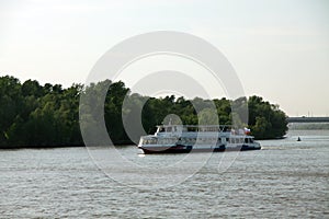 Pleasure boat floating on the river. transportation concept