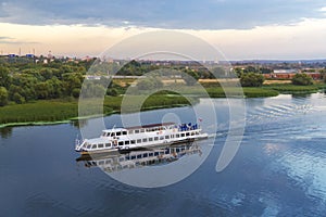 Pleasure boat on the Moscow River in the sunset