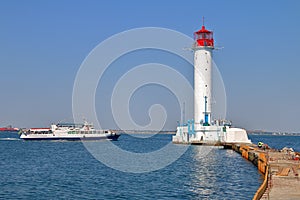 Pleasure boat sailing near the Odessa lighthouse
